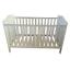 White cot bed with balls